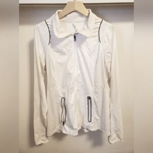 Lululemon light jacket. White. Silver reflective parts. Size 12. Run.
